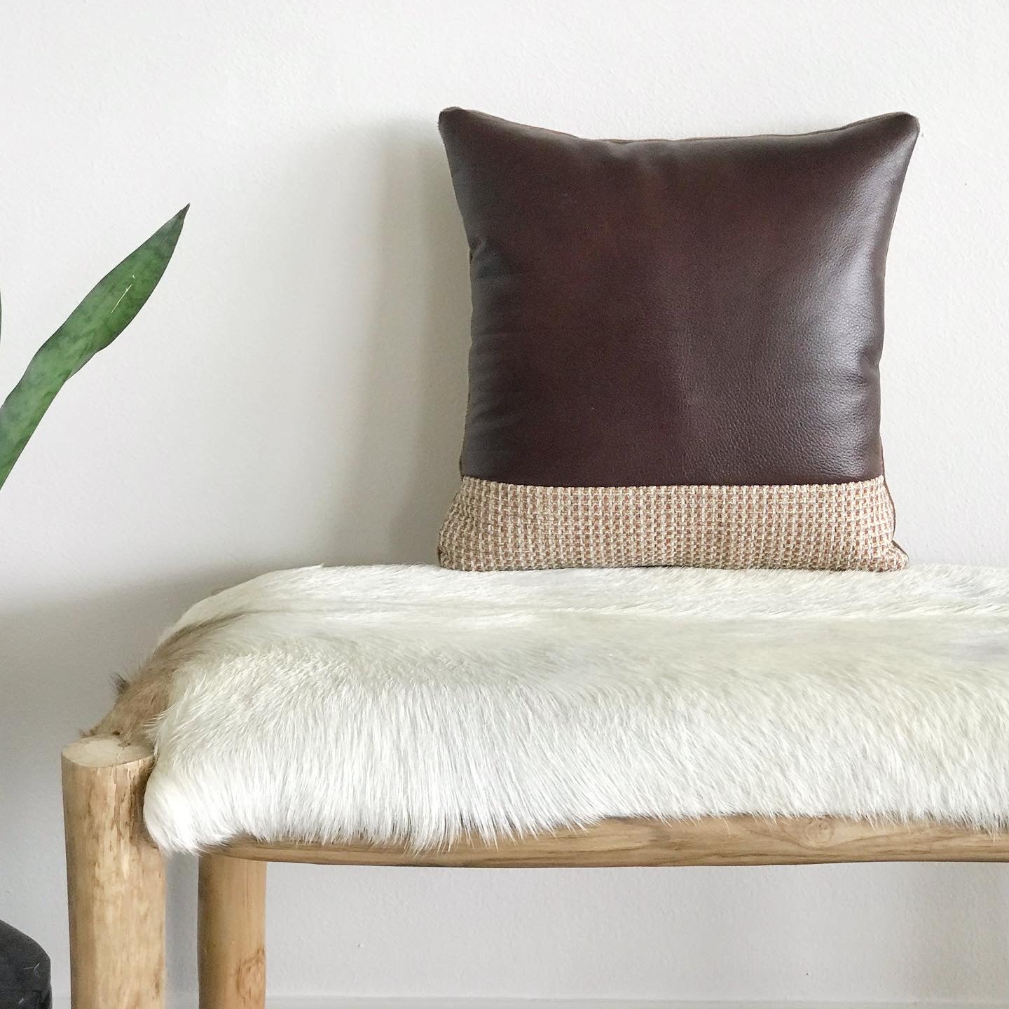 Revision Goods pillow on sofa in living room